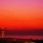 まんまる夕日と、はんぶんお月様の追いかけっこ。