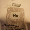 PUPULA（ププラ）パフュームボトルモチーフTシャツ