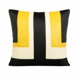 『黄色、黒、白を使ったシンプルなクッションカバー』の画像